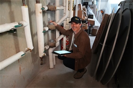 CORE employee analyzing a building to improve its energy efficiency